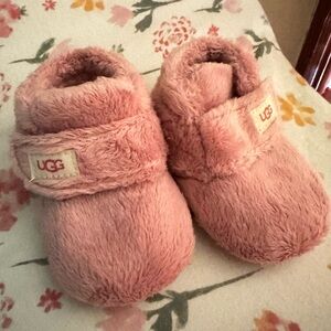 Never worn infant UGG booties. Pink and precious